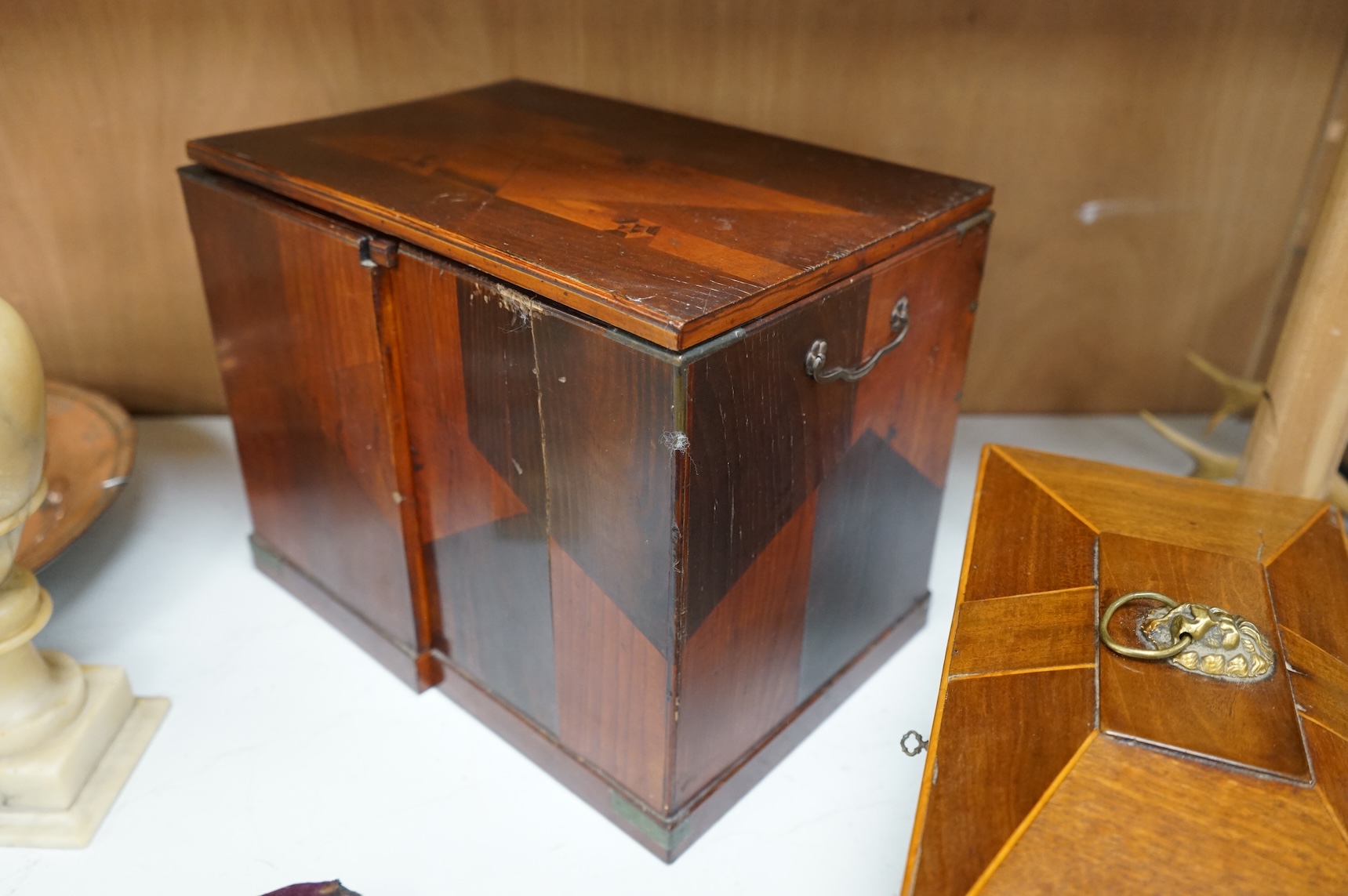 A Japanese parquetry table-top cabinet and a 19th century tea caddy, cabinet 33cm wide, 26cm high.
